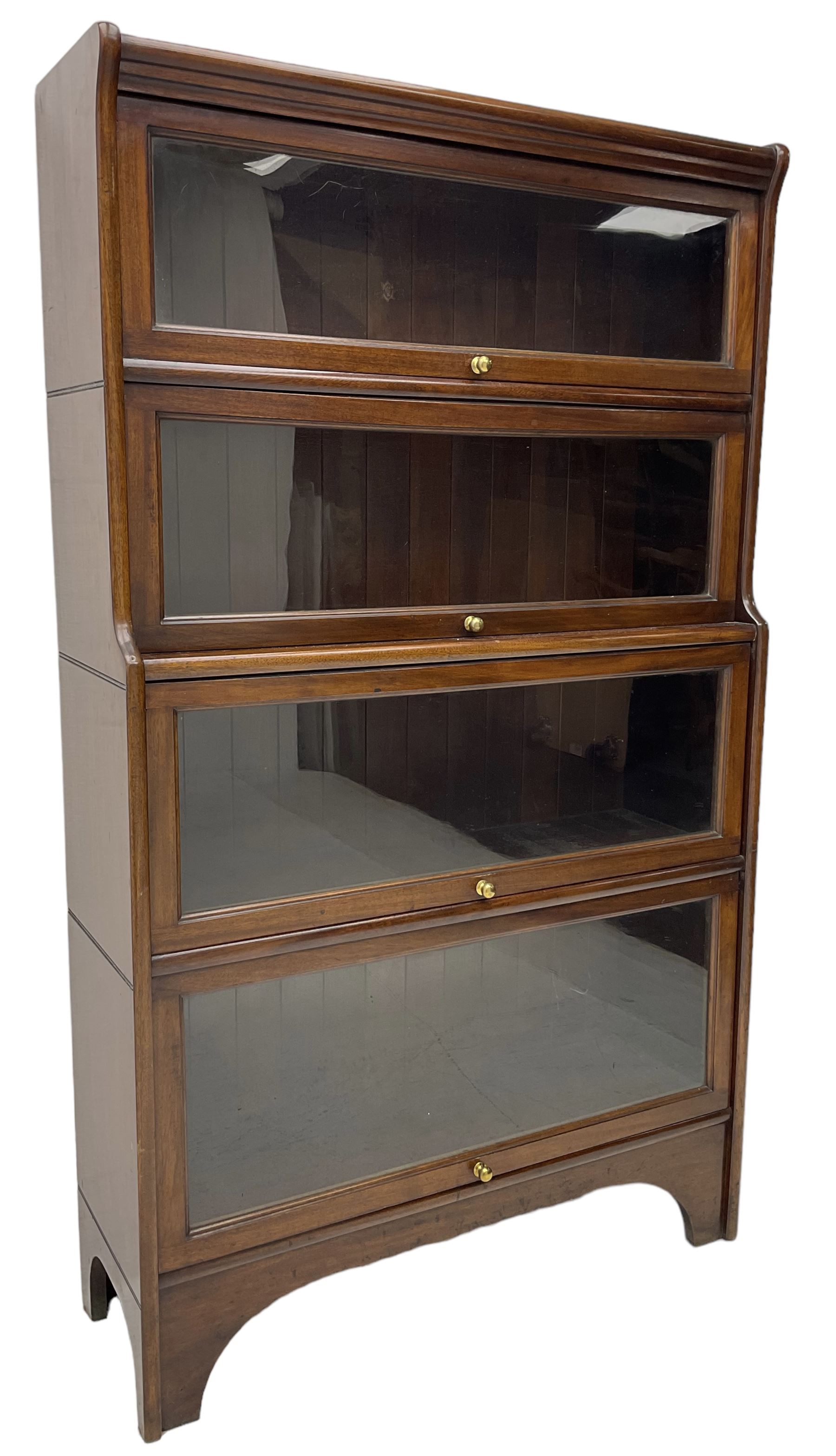 Kenric Efferson - early 20th century mahogany four-tier library bookcase, enclosed by four glazed up-and-over doors, on bracket feet