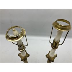 Two brass candlesticks modelled as Corinthian columns, with decorative pierced shades and square base, columns excl fittings H25cm