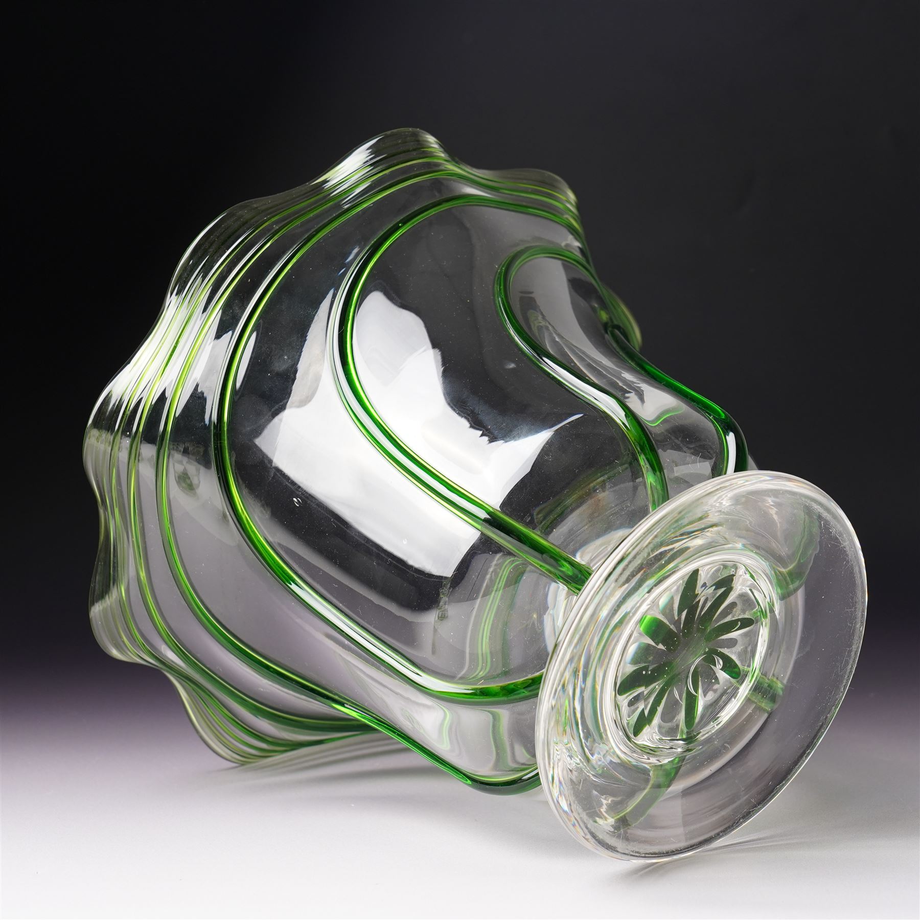 Three early 20th century glass vases, attributed to Stuart and Sons of Stourbridge, each with green glass art nouveau spiral decoration, largest H18cm (3)