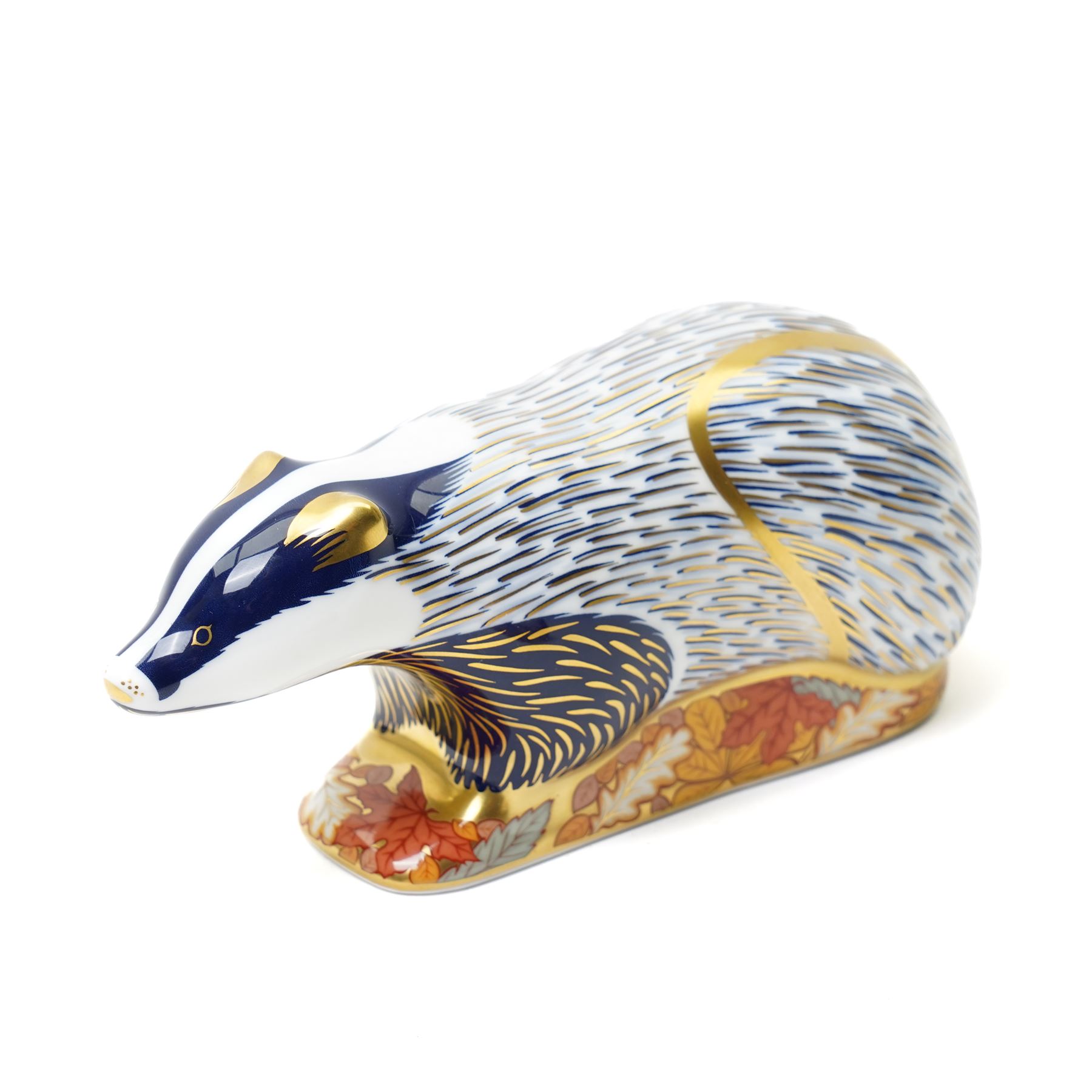 Three Royal Crown Derby paperweights, comprising two of Bramble the Hedgehog, with gold stopper, with boxes, and one of a Woodland Badger, with gold stopper, boxed (3)