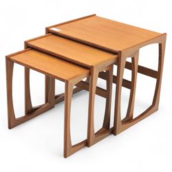 G-Plan - mid 20th century nest of three teak tables, rectangular tops with rounded edges, supported by sculptural open sided frames