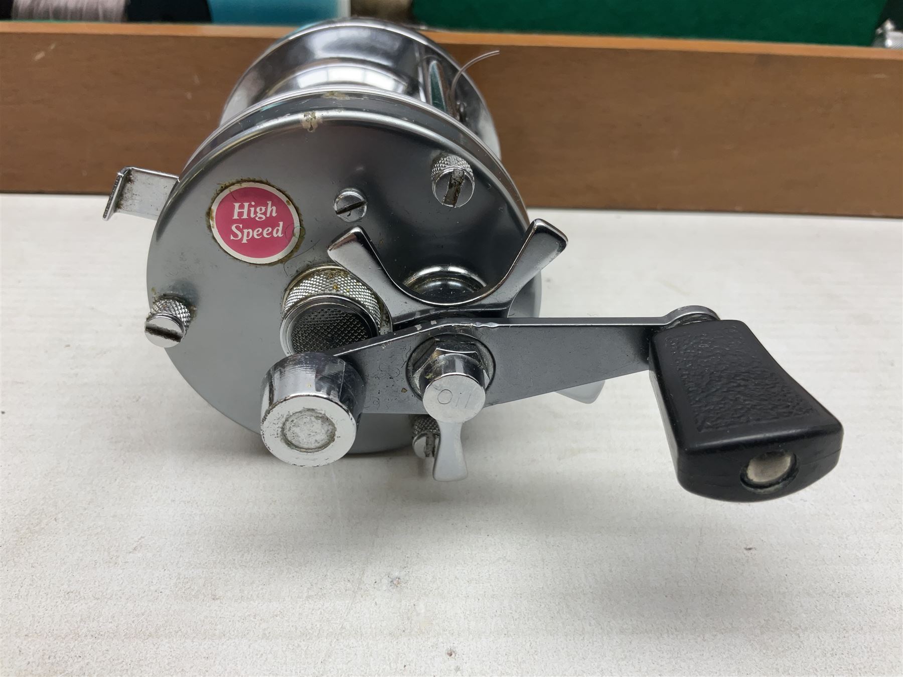 Four Abu fishing reels, comprising Ambassadeur 9000, Ambassadeur 7000, Ambassadeur 5500 and Ambassadeur 6500, together with additional line, hardy fishing bag and two wooden boxes