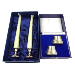  Shop stock: Pair of dwarf candlesticks with candles boxed and a pair of silver candle holders cased both by L R Watson   
