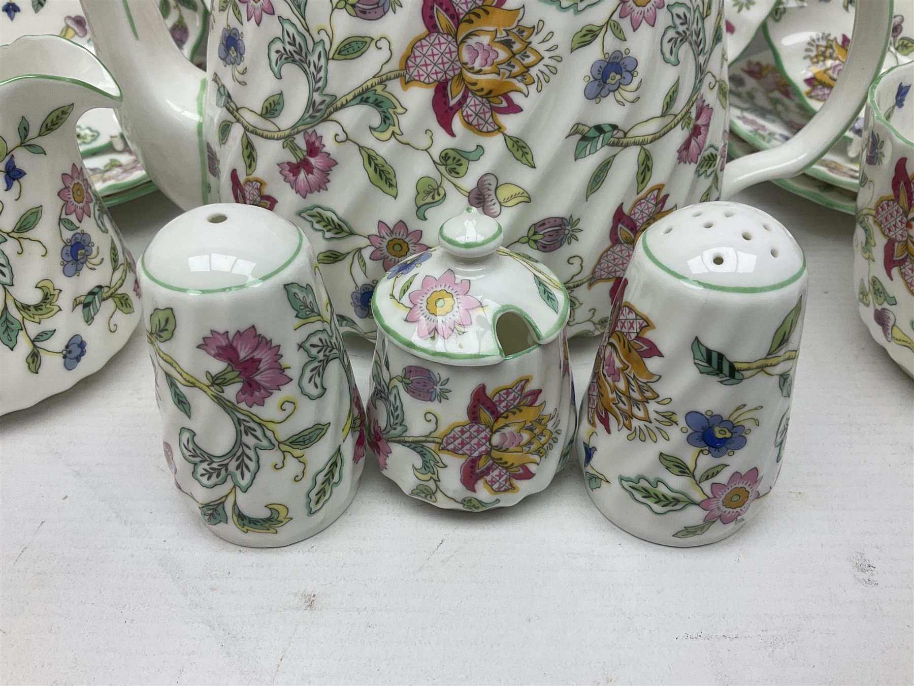 Haddon Hall tea service for six, comprising teapot, open sucrier, milk jug, cups and saucers, dessert plates, one cake plate and cruet set 