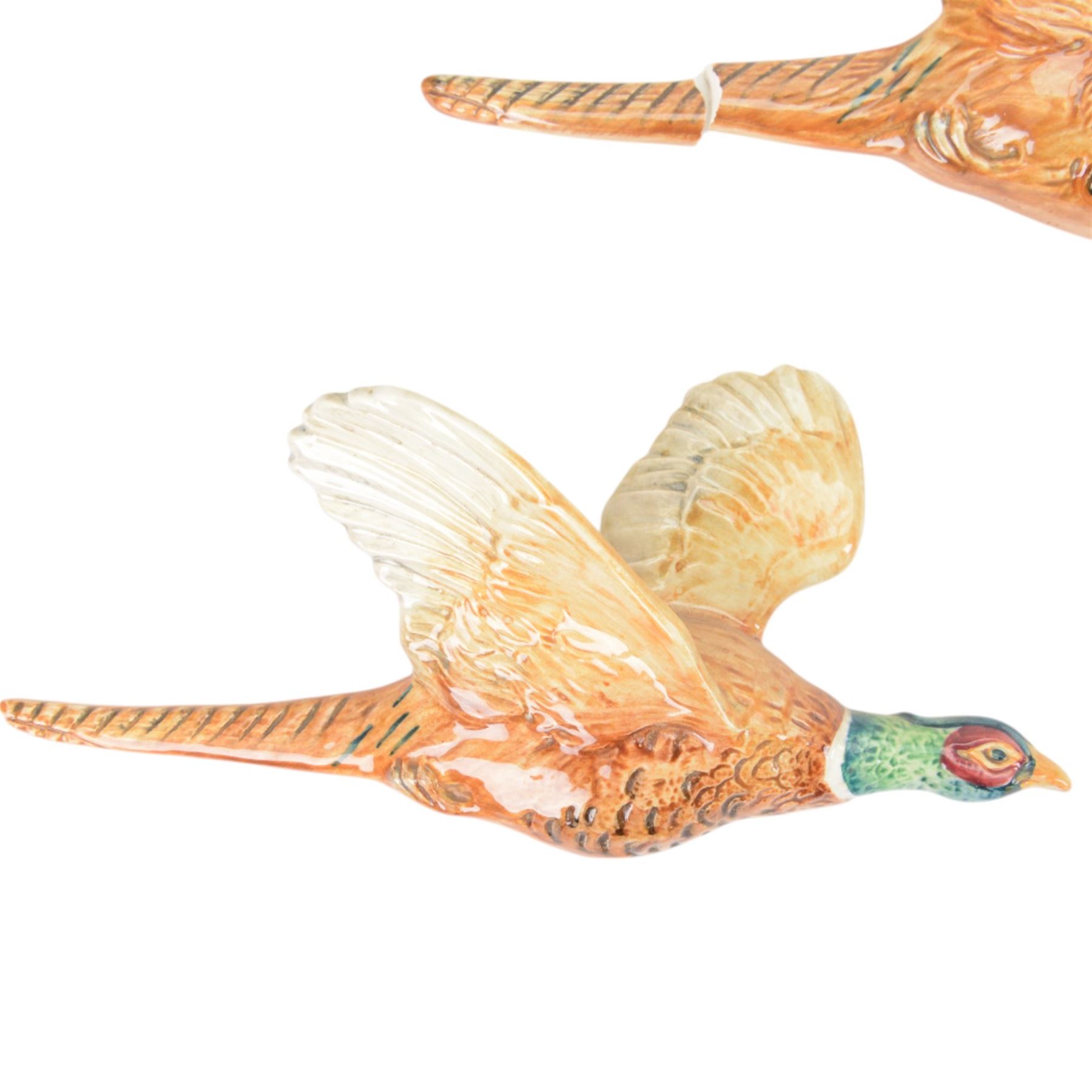 Set of three graduating Beswick pheasant wall plaques, all with printed marks beneath and impressed 661, largest H14cm