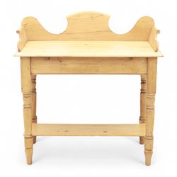 20th century pine washstand, shaped three-quarter gallery back over rectangular top, raised on turned supports with lower undertier