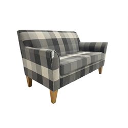 Next - two seater sofa, upholstered in grey check fabric, on tapered supports