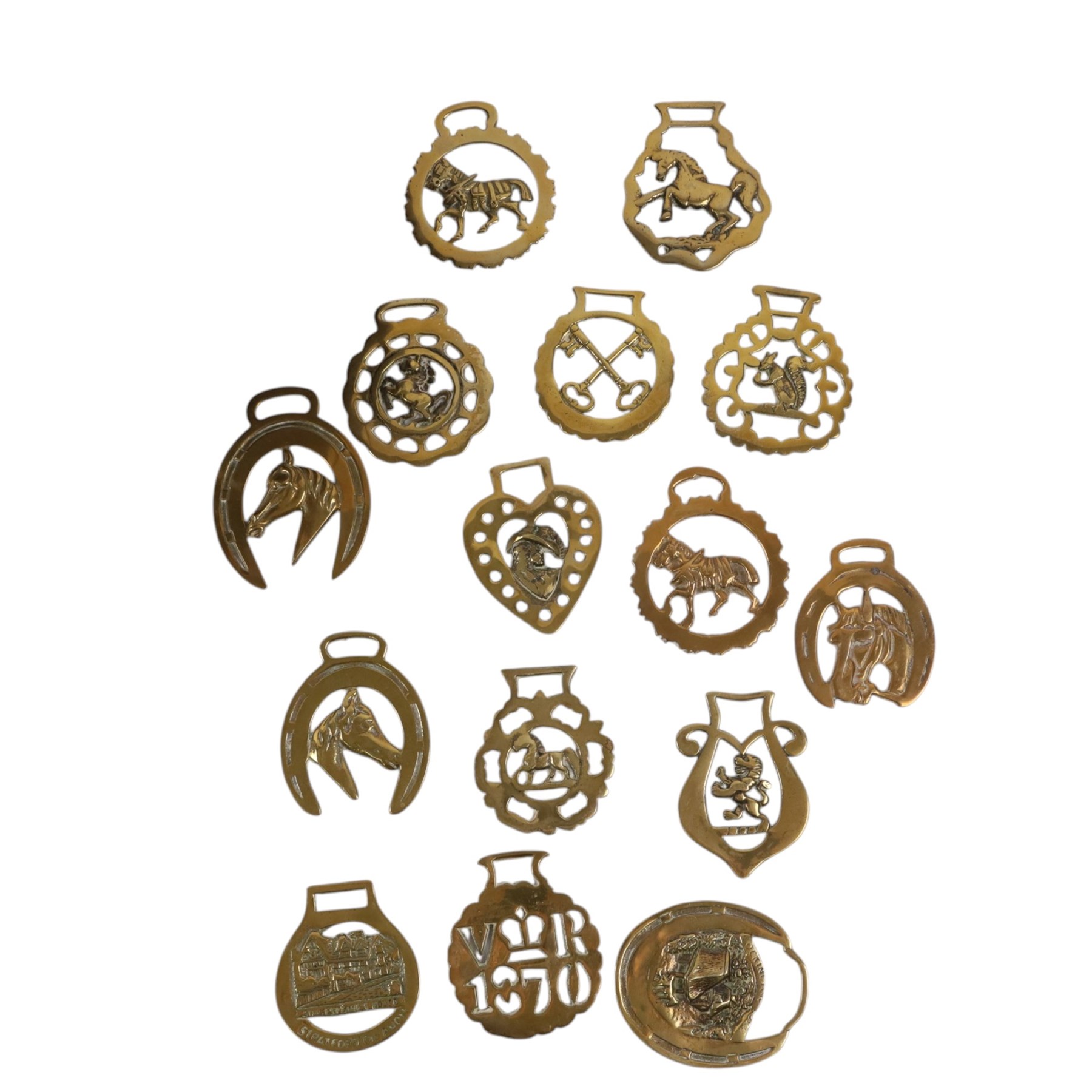 Cast iron door stop, together with copper bowl and horse brasses 