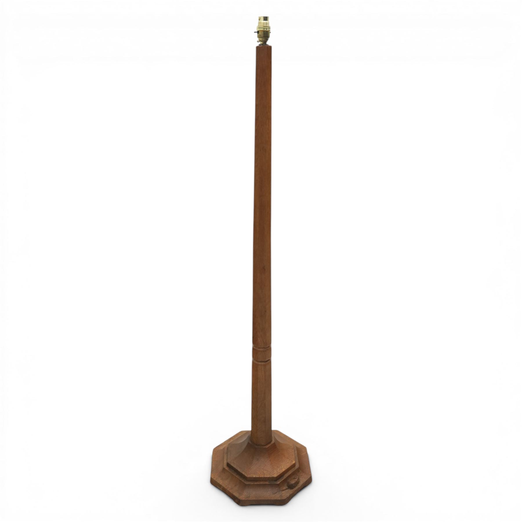 Mouseman - oak standard lamp, with octagonal base and column, with carved mouse by the workshop of Robert Thompson of Kilburn