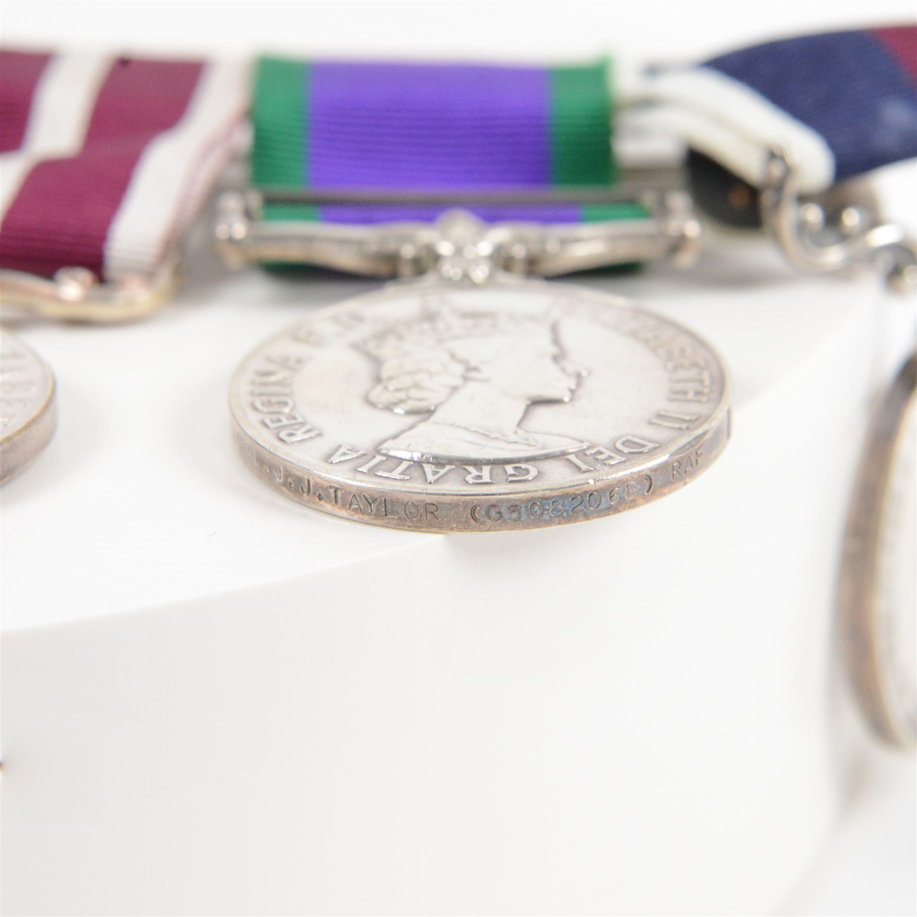 ERII RAF medal trio, Meritorious Service, Campaign Service, with Northern Island clasp, and Long Service, awarded to JJ Taylor (65082068) RAF together with AFCENT breast tab and police badges