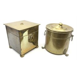 An early 20th century brass coal bin, with twin ring handles, beaded detail, and raised upon four compressed bun feet, H31.5cm, together with another example with twin ring handles and raised upon three paw feet. (2). 