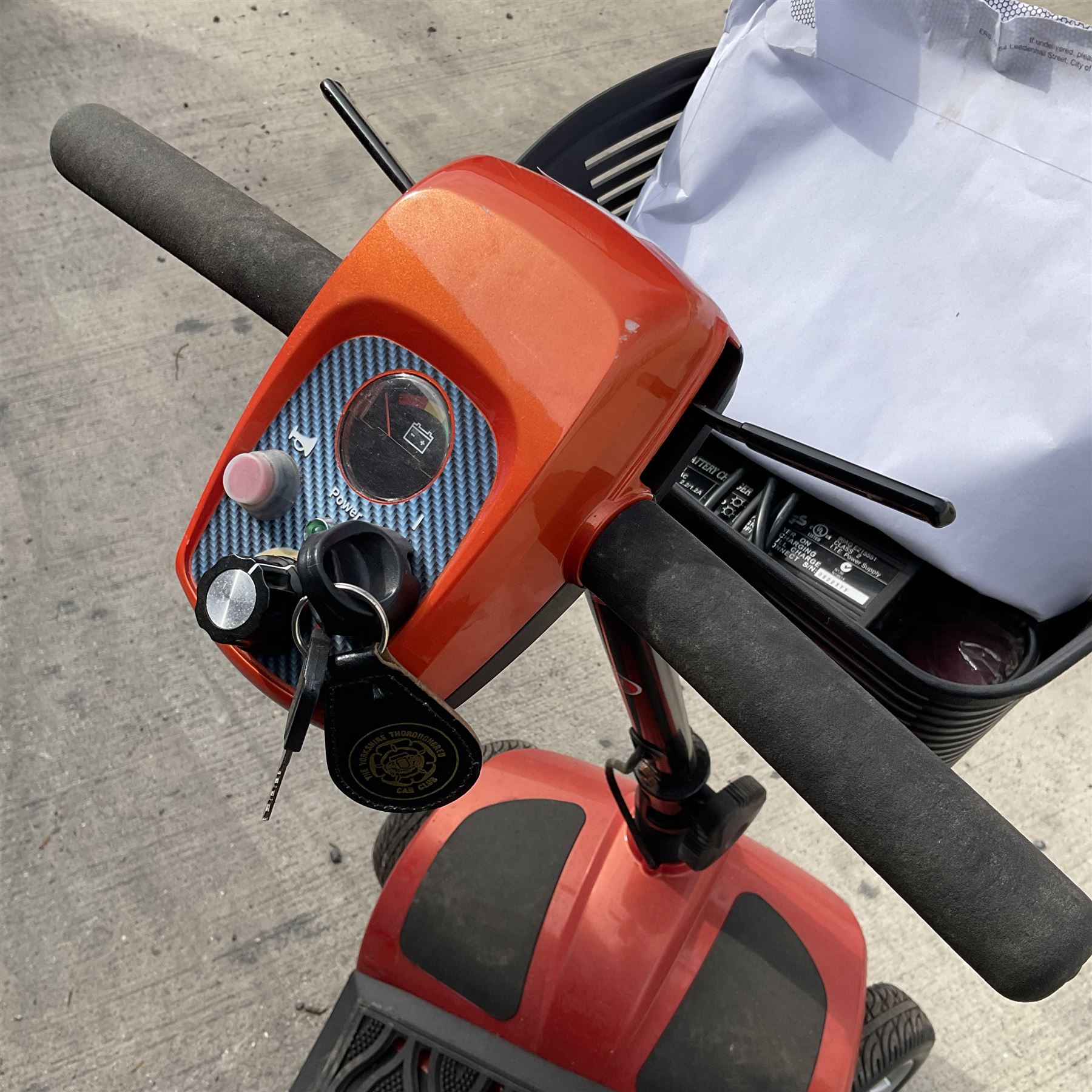 Four wheel electric mobility scooter in orange with keys and charger  - THIS LOT IS TO BE COLLECTED BY APPOINTMENT FROM DUGGLEBY STORAGE, GREAT HILL, EASTFIELD, SCARBOROUGH, YO11 3TX