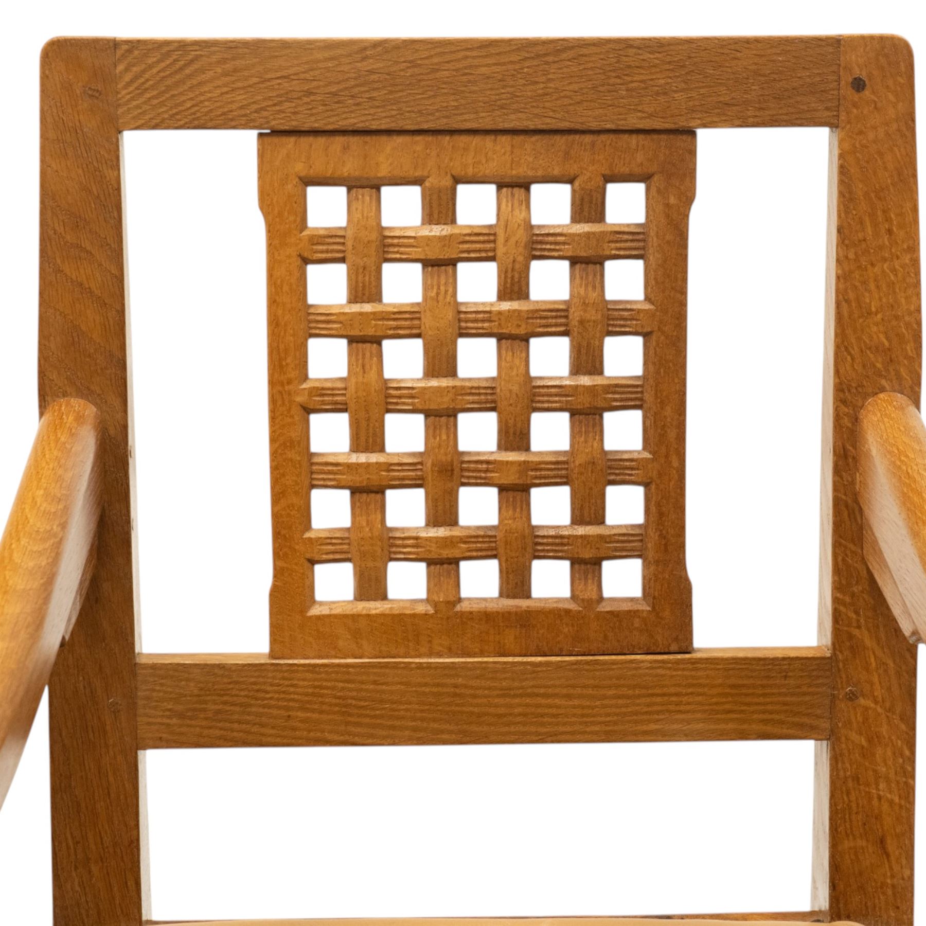 Rabbitman - pair of Yorkshire oak carver open armchairs, pierced and carved lattice back over tan leather seat with studwork, raised on octagonal supports united by H stretchers, carved with rabbit signature, by Peter Heap of Wetwang