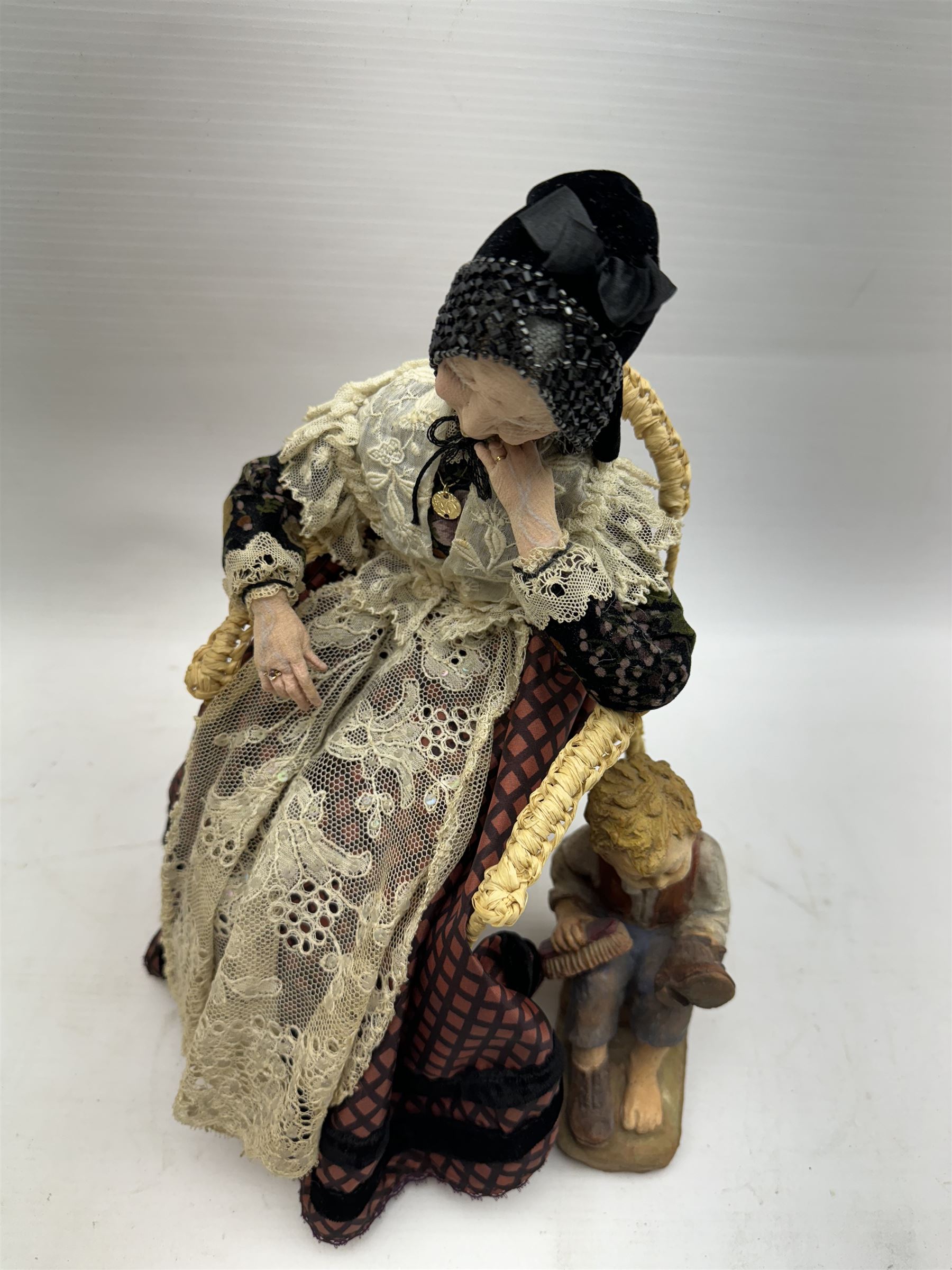 Anna Meszaros (Hungarian 1905-1998): 'My Great Granny', handmade needlework figurine, together with small plaster cast of a young boy by the same artist, granny H30cm
Auctioneer's Note: Anna Meszaros came to England from her native Hungary in 1959 to marry an English businessman she met while demonstrating her art at the 1958 Brussels Exhibition. Shortly before she left for England she was awarded the title of Folk Artist Master by the Hungarian Government. Anna was a gifted painter of mainly portraits and sculptress before starting to make her figurines which are completely hand made and unique, each with a character and expression of its own. The hands, feet and face are sculptured by layering the material and pulling the features into place with needle and thread. She died in Hull in 1998