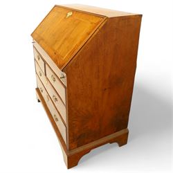 18th century walnut and herringbone banded bureau, the fall front enclosing a stepped and arched interior fitted with pigeonholes, drawers and concealed compartments, green tooled leather writing surface, over two short and three long graduated drawers with brass escutcheons and bail handles, shaped bracket feet