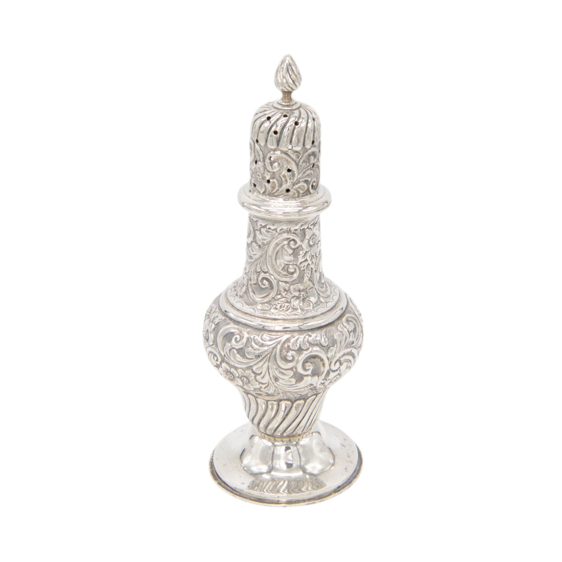 Edwardian silver sugar caster, of typical waisted form profusely embossed with floral and foliate decoration, the removable pierced cover with fluted finial, upon a circular stepped foot, hallmarked William Aitken, Birmingham 1901, H23cm