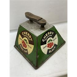 Cherry Blossom Shoe Polish shoe shine box, of sloping form, with three pictorial enamel panels advertising dark tan, black and light tan polishes, the reverse with a hinged compartment, the top mounted with a handle and foot rest in the form of a shoe sole, H29cm W42cm D33cm