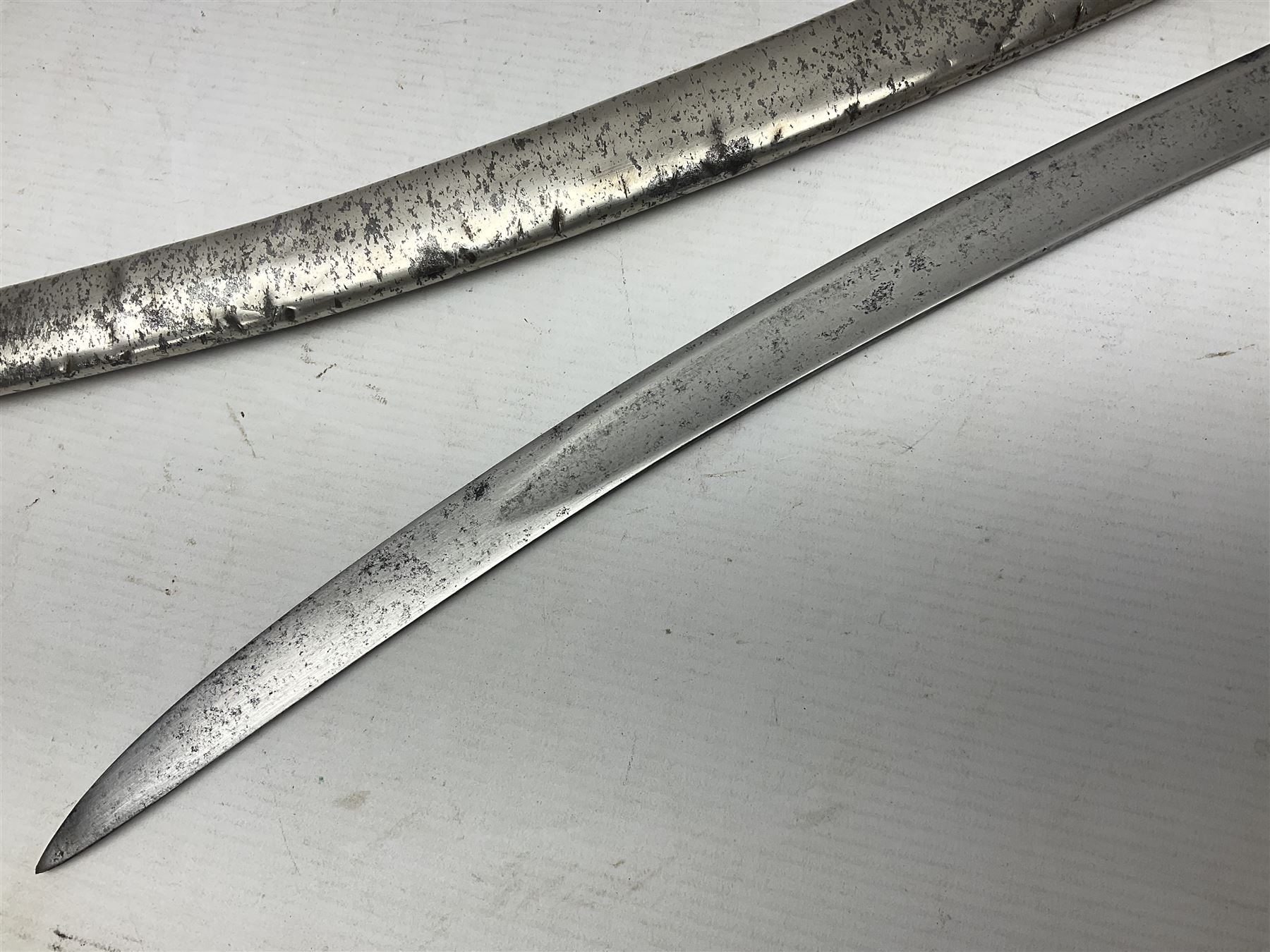 19th century Russian Imperial Navy sword, with 77.5cm curving fullered blade, brass three-bar hilt with lozenge shaped langets and wire-bound leather grip; in polished steel scabbard with one suspension ring L97cm overall