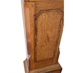 An oak and mahogany longcase clock by William Hewson, Lincoln c 1860, with a swans neck pediment, ball and spire finials and brass paterae, break arch hood door flanked by reeded pilasters with brass capitals, oak trunk with canted corners and a short oak door with mahogany crossbanding, conforming plinth with applied skirting, fully painted dial with Roman numerals, minute track and subsidiary seconds dial, matching brass stamped hands and winding collets, depiction of a  sportsman to the break arch and corresponding game birds to the spandrels, dial pinned directly to an eight-day rack striking movement with a recoil anchor escapement, striking the hours on a bell. Original casemakers label pasted to the inside of the case 