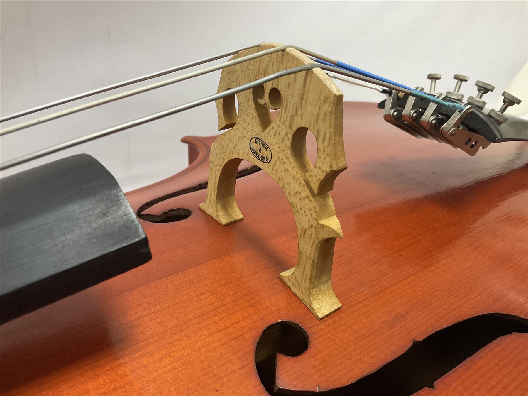 3/4 size cello with soft case, 69cm back length, 114cm full length, with bridge, ebonised tail piece and fingerboard.