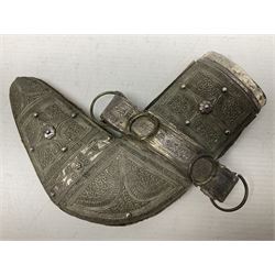 Omani Khanjar dagger, the 12.5cm curved blade with pronounced medial rib to either side, waisted horn style hilt with dome shaped pommel and inlaid pique work; in an intricately filigree decorated white metal scabbard with rings woven into the belt mount L25cm overall