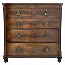 Early 19th century mahogany chest, two short and three long drawers, canted corners with cluster column pilasters, on turned feet