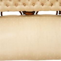 Edwardian inlaid mahogany sofa, upholstered in cream fabric with buttoned back rail, tapering legs on brass castors