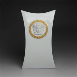 Rosenthal Versace Gorgona vase, of concave form, decorated in relief with medusa masks and...