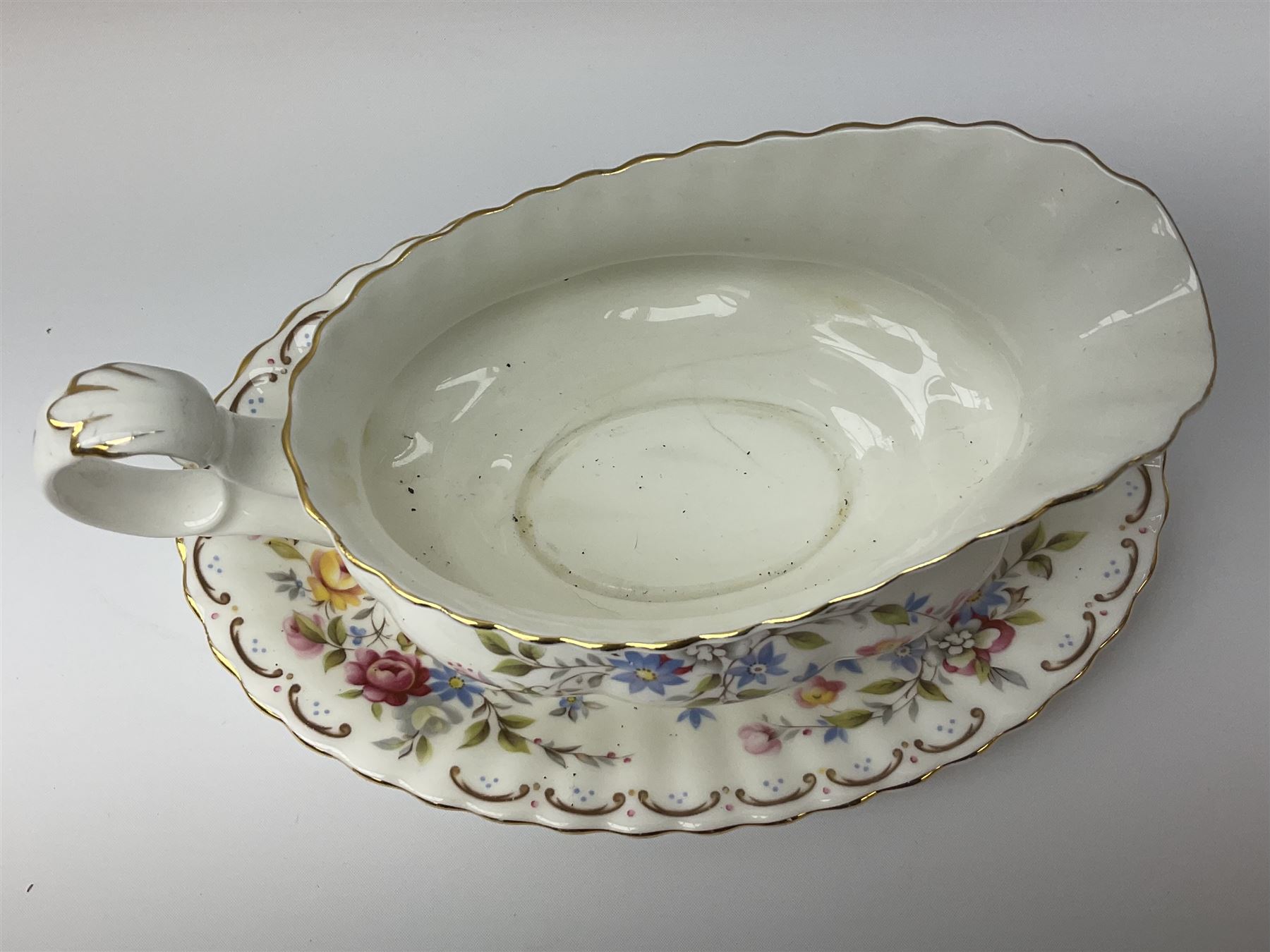 Royal Albert Old Country Roses pattern tea set, comprising teapot, coffee pot, six teacups and six saucers, five side plates, further teacup with joined saucer and side plate, open sucrier, milk jug, cake plate, and preserve pot and cover, together with Royal Albert Jubilee Rose pattern sauce boat and stand, and Royal Albert Lavender Rose pattern cake stand. 