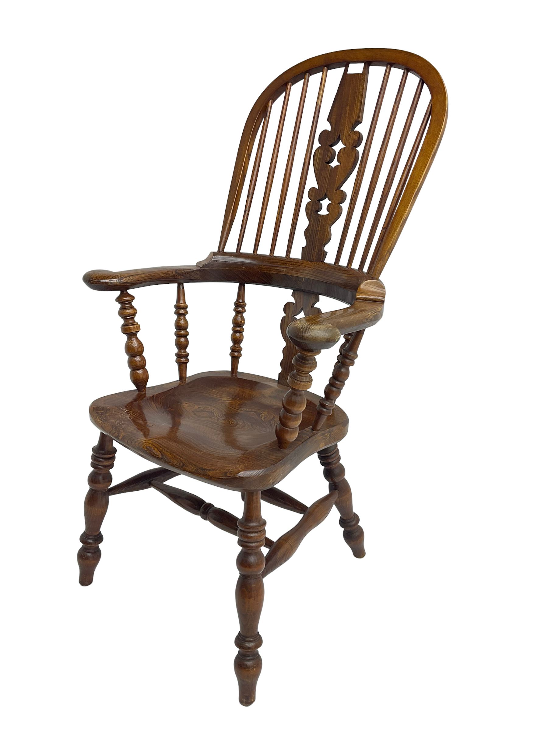 Traditional elm Yorkshire style Windsor armchair, high back with pierced and fret work splat, turned supports joined by double H stretcher
