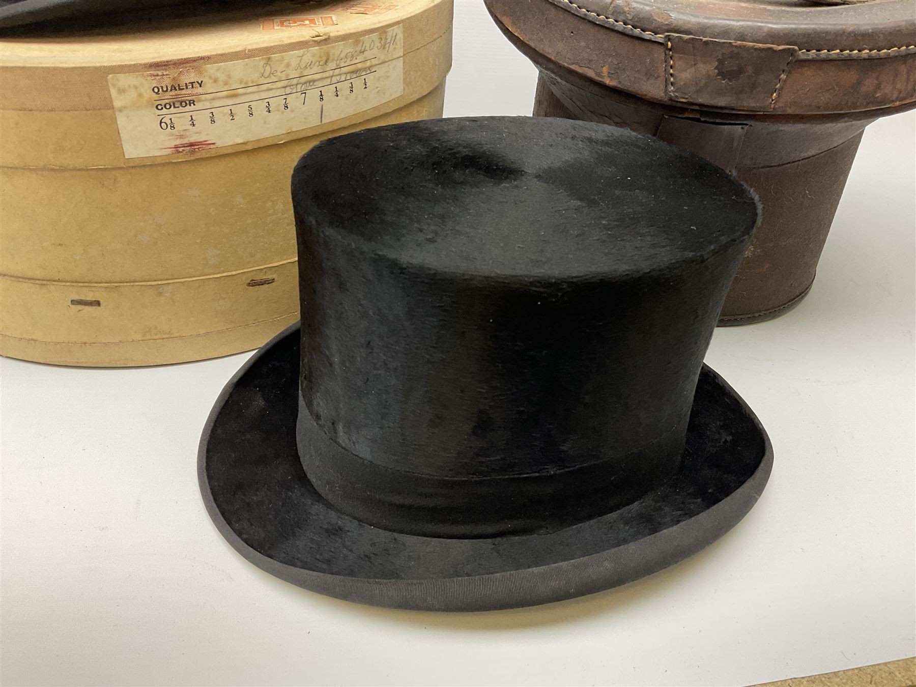 Top hat by Tress & Co London, in a  fitted leather leather case,  Top hat by Chapellerie Francaise. 