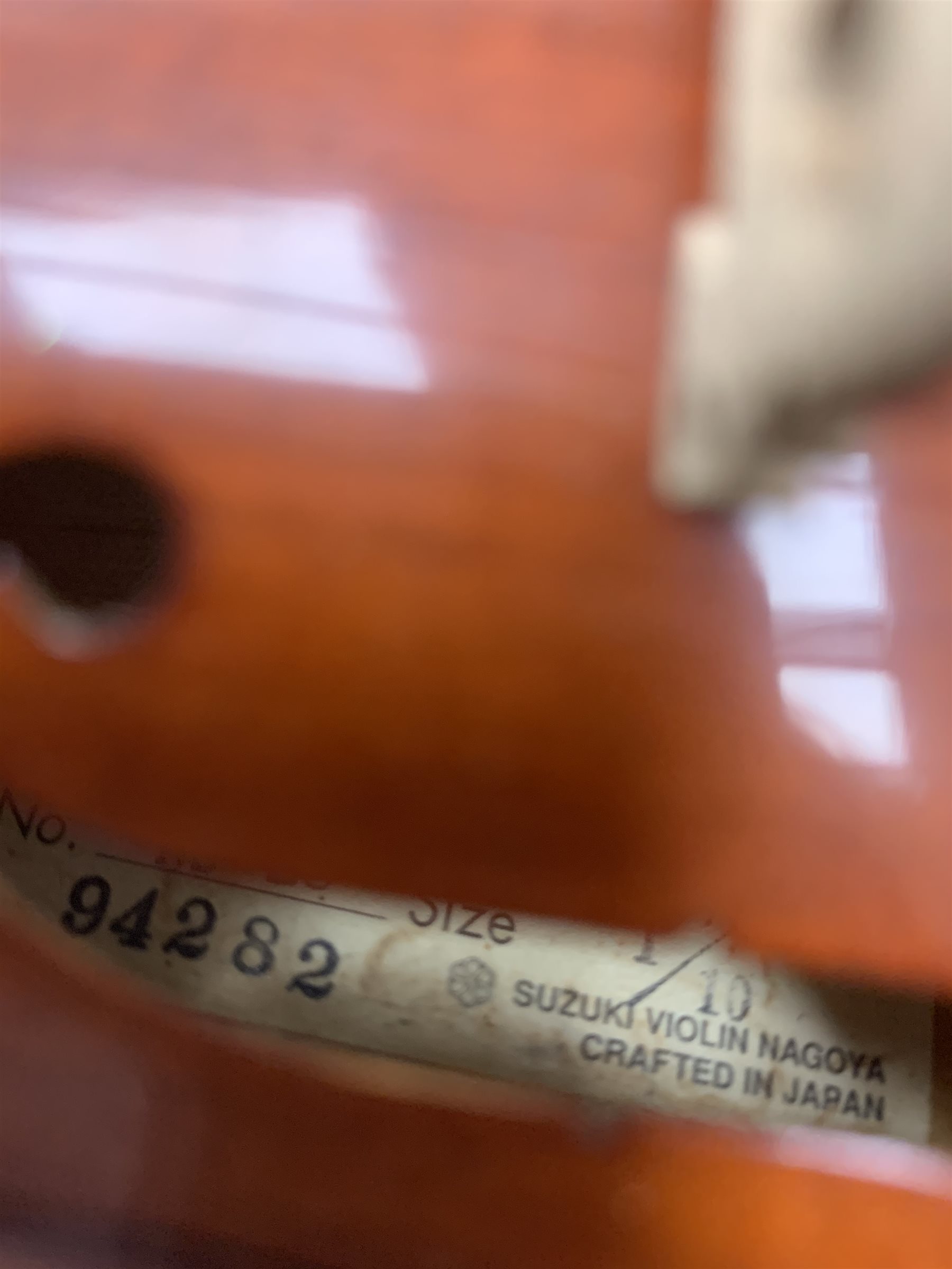Three modern graduated violins - Suzuki 1/10 size child's violin with 23.5cm single piece back, bears label serial no.94282, 40cm overall; copy of Antonius Sradivarius of Cremona violin dated 1998 with 28cm two-piece back, 47cm overall; and Strobel violin with 35.5cm two-piece back, bears label dated 2006, serial no.512801325, 59cm overall. All cased with bows (3)