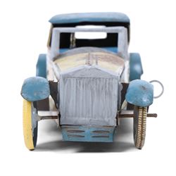 Wells tinplate clockwork limousine, the cream body, with blue roof and lithographed details, with driver and key, H8cm, L23cm