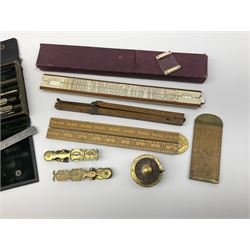 Two Victorian brass sovereign scales, one marked 'Harrison' L10cm; cased set of drawing instruments by G. Thornton Limited Manchester; Chesterman No.770/1 steel vernier caliper; two boxwood rulers; cased slide rule; brass and boxwood rope/wire gauge etc
