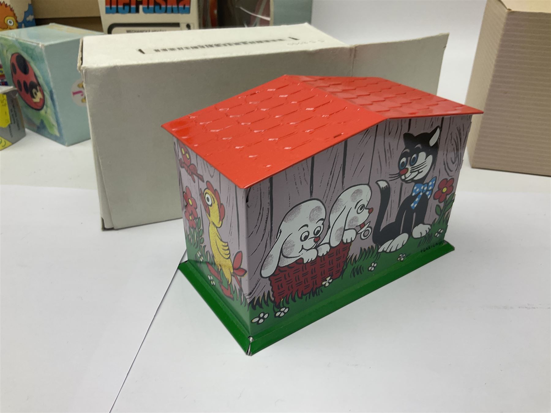 Twenty six tinplate models to include Ferris Wheel and Performing Circus Elephant, marked JW, further similar examples such as Duck on a Bike, Clown on Roller, Carousel; Popeye Tin Speedboat; Looney Tunes Wind Up Cars and Express Train; various international examples, MS107 Jumping Bambi, Pop Pop Boat, jumping frogs, pecking chickens etc; both boxed and loose