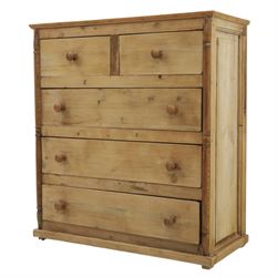 Victorian polished pine chest, straight front with panelled sides, fitted with two short and three long drawers, turned wooden handles