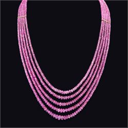 18ct gold pink sapphire necklace, five graduating stands of faceted pink sapphires, with a...