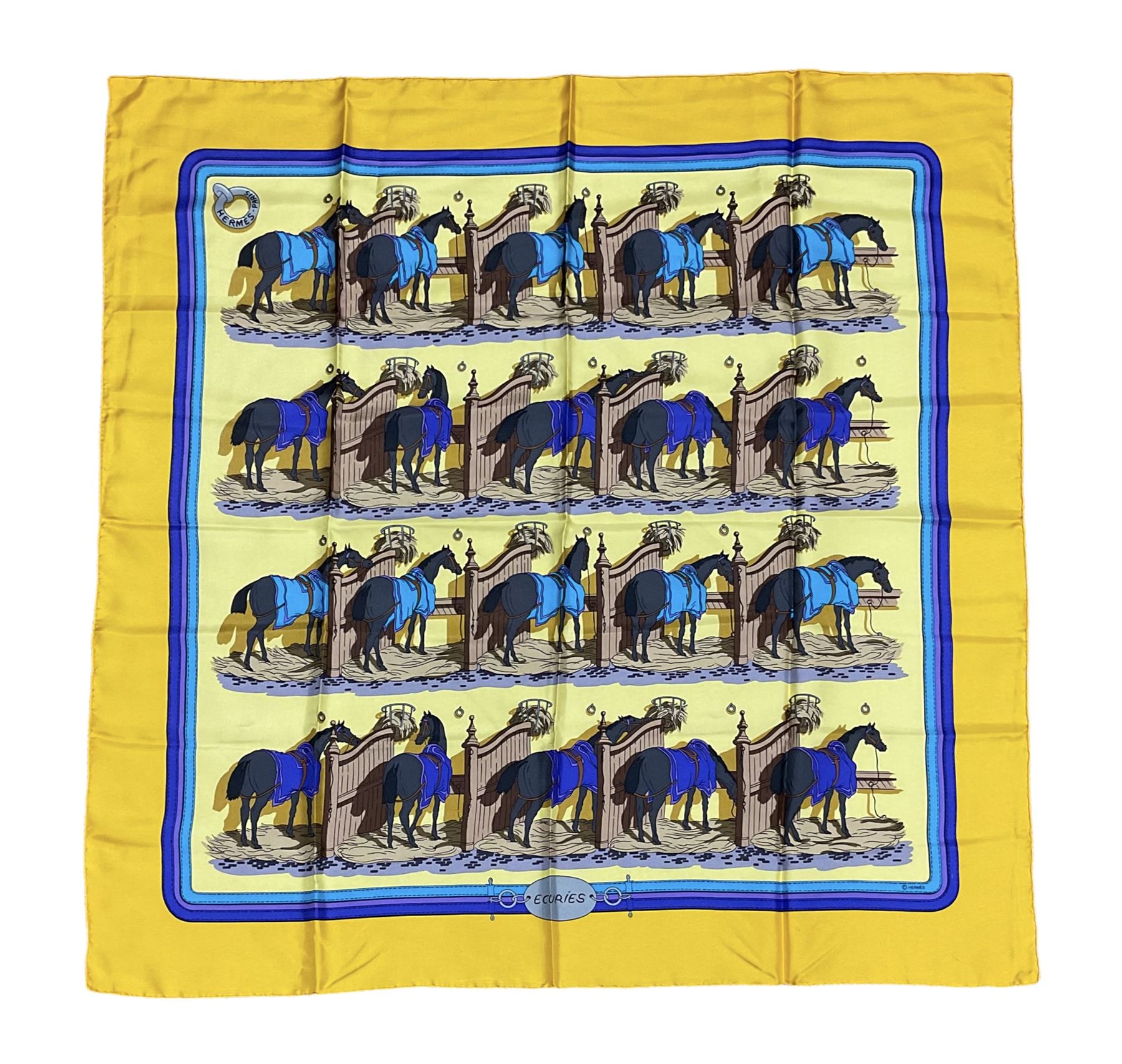 Hermès 'Ecuries' silk scarf, designed by Hugo Grygkar in 1947, printed with twenty horses in their respective stables, on yellow ground contained within stitched effect blue and purple and darker yellow gold borders, with rolled hand stitched edges and Hermes material label, 87cm square