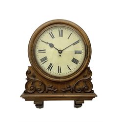 Winterhalter and Hoffmeier -  German oak cased early 20th century fusee wall clock, with a circular wooden surround and a spun brass glazed bezel to the dial, housed on an integral carved bracket with shaped corbel supports, painted dial with Roman numerals, minute track and steel spade hands, dial pinned directly to a four pillar chain driven fusee movement with a recoil anchor escapement. With pendulum and key. 
German fusee movements by Winterhalter and Hoffmeier are comparatively rare, especially housed in carved wall clocks of this description. 