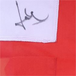Scuderia Ferrari 2004 shirt, bearing four signatures including Michael Schumacher and Rubens Barrichello, to commemorate five consecutive World Championship wins, in glazed frame, frame H85cm