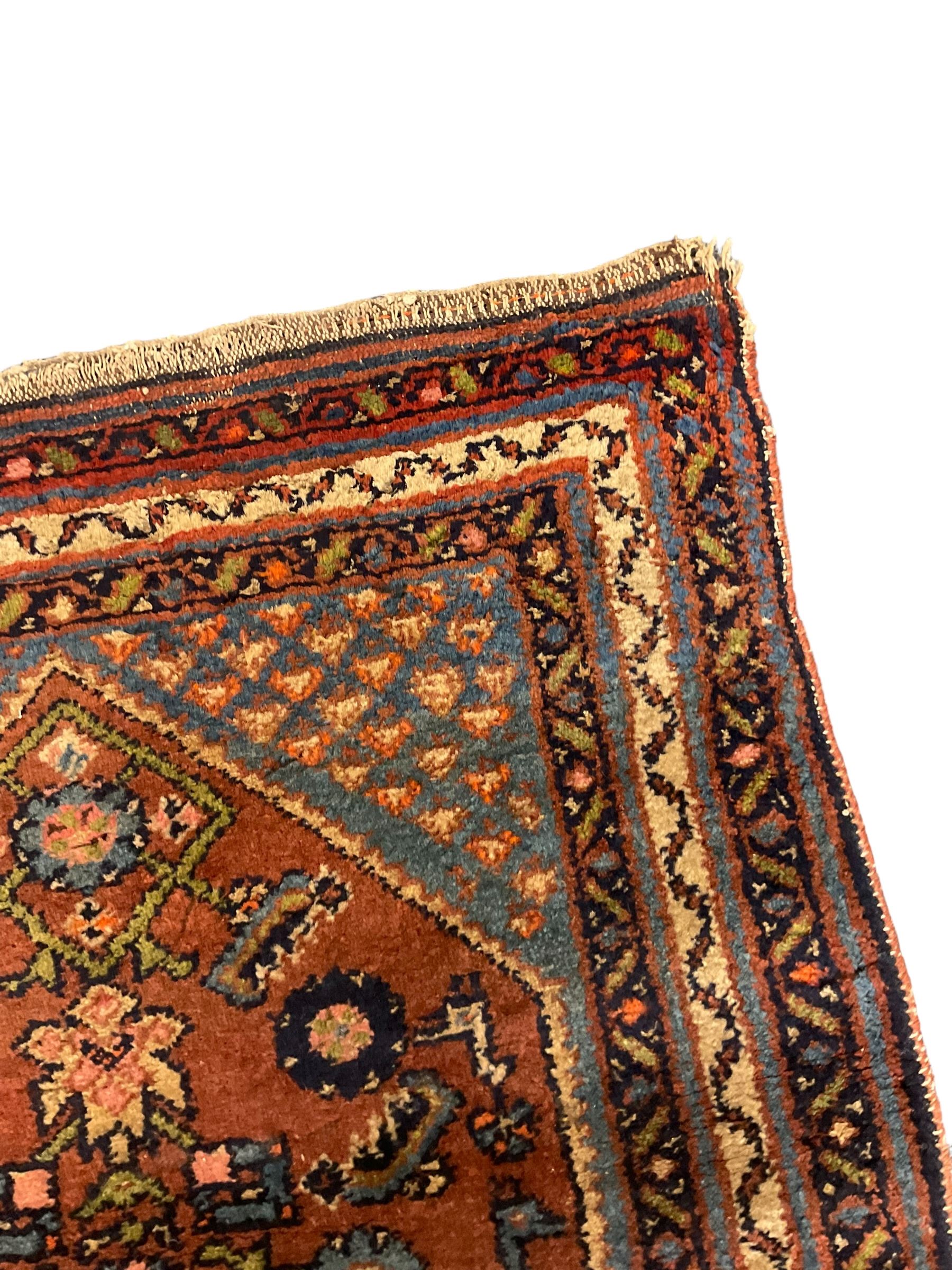 Small Persian rug or mat, decorated with Herati motifs within pattern borders 