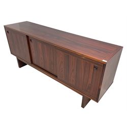 NH Chapman & Co Siesta - mid-20th century sideboard, fitted with three sliding doors, enclosing two drawers and shelves, raised on twin end supports