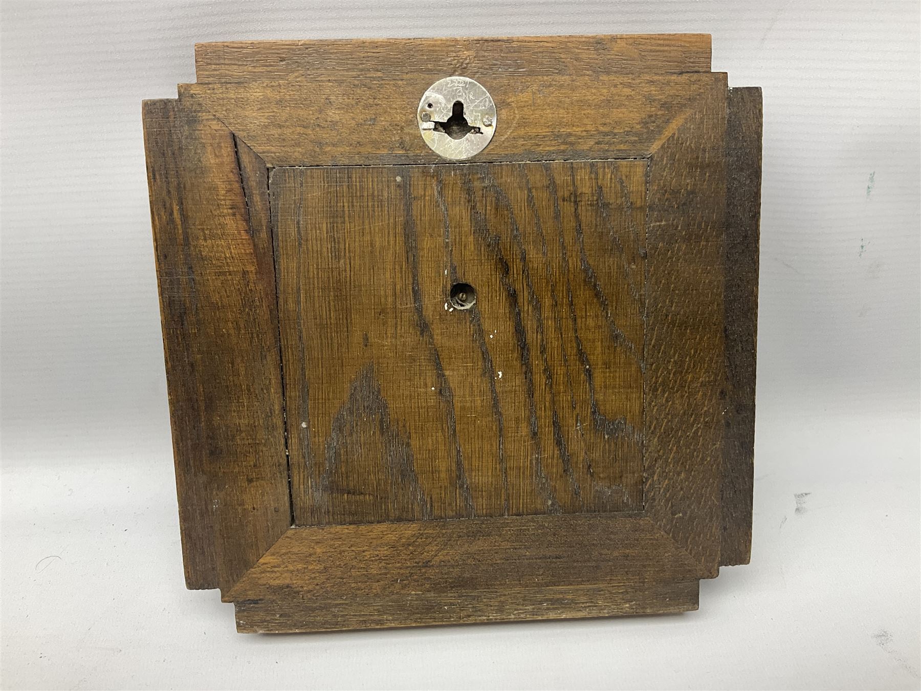 Smiths barometer in carved and stepped oak square case, together with a small copper 8 days clock with bevelled glass plate