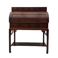 Hardwood cylinder desk, three drawers raised over curved lid, fitted interior with slide, the supports joined by undertier with fret work brackets 