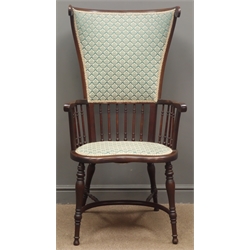  Early 20th century mahogany armchair, raised curved back and arms with spindle turned balustrade, turned supports with crinoline stretcher, possible by Shapland and Petter of Barnstaple   