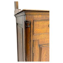 19th century and later oak dresser, moulding cornice a pierced and shaped frieze, over two open plate shelves above a base fitted with two drawers with brass swan neck handles, over panelled twin cupboard with single shelf, cantered corners on bracket feet