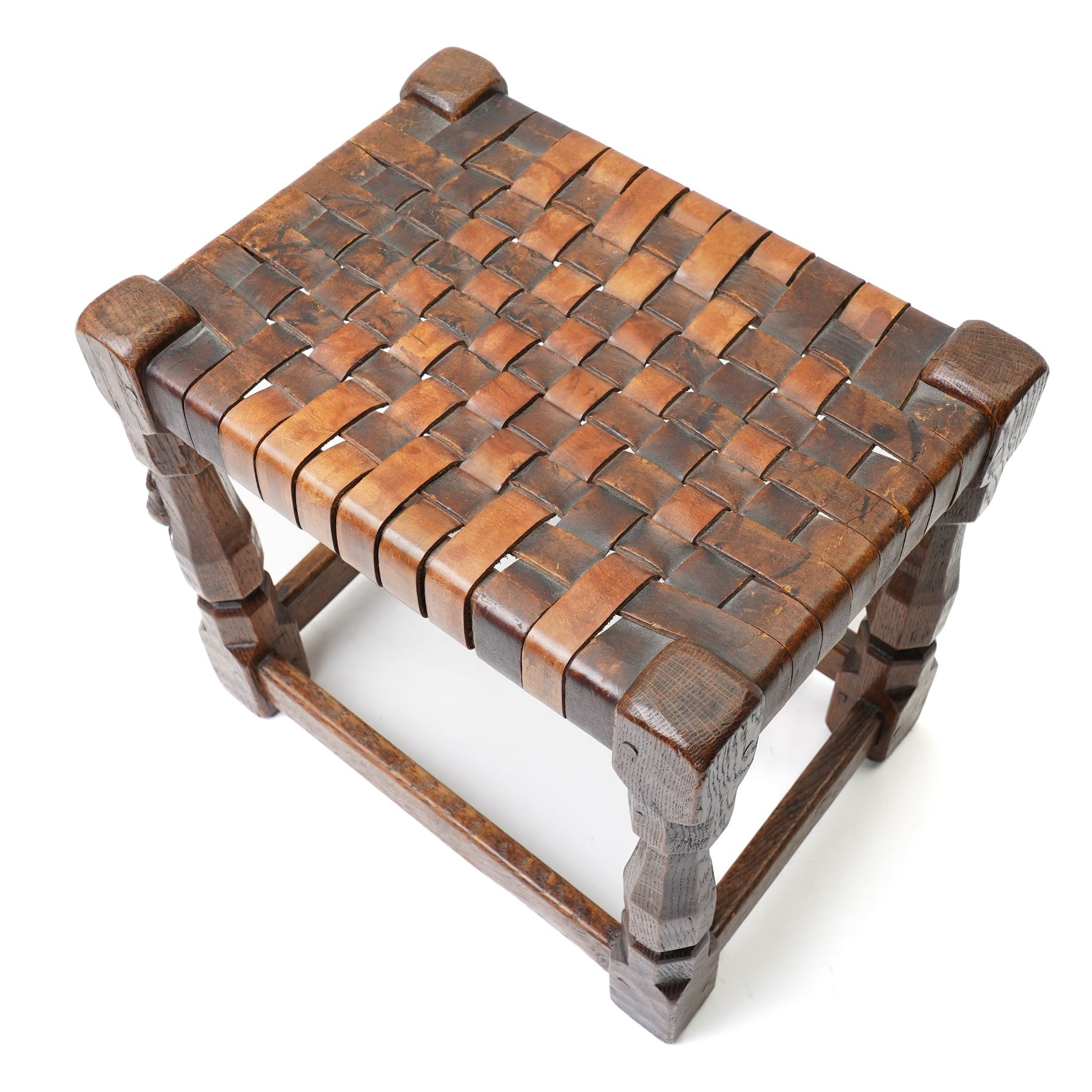 Mouseman - 1930s adzed oak joint stool, leather latticework seat on chamfered octagonal supports, carved with mouse signature, by Robert Thompson of Kilburn