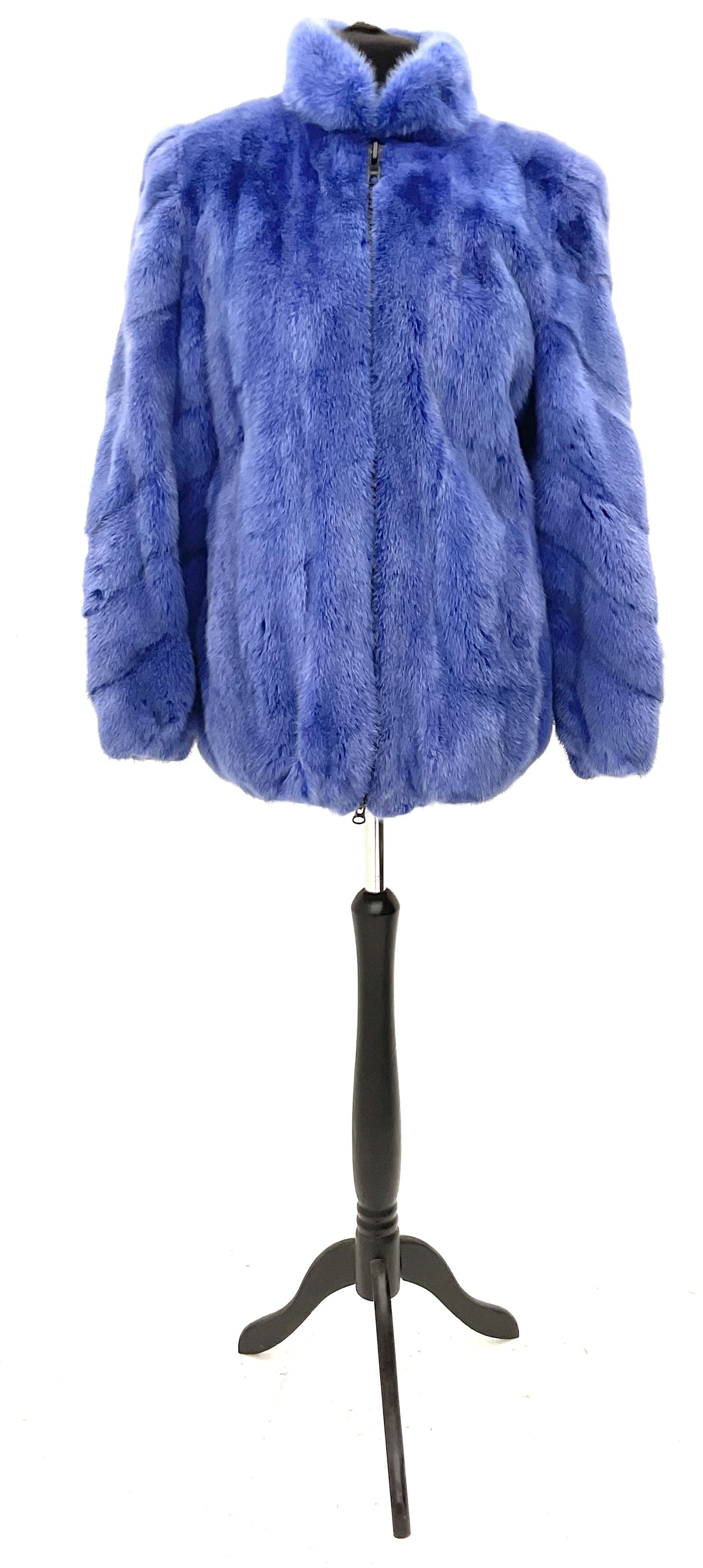 Modern cut lightweight skins lavender blue mink jacket, approx size 10 to 14, with elasticated cuffs, stand up small collar, black satin style lining, zip fastener, perfect condition as new, top class mink.
