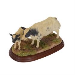 Three Border Fine Arts cow figure groups, comprising Belgian Blue Cow and Calf A1252, Hereford Bull A20848 and Simmental Bull L102