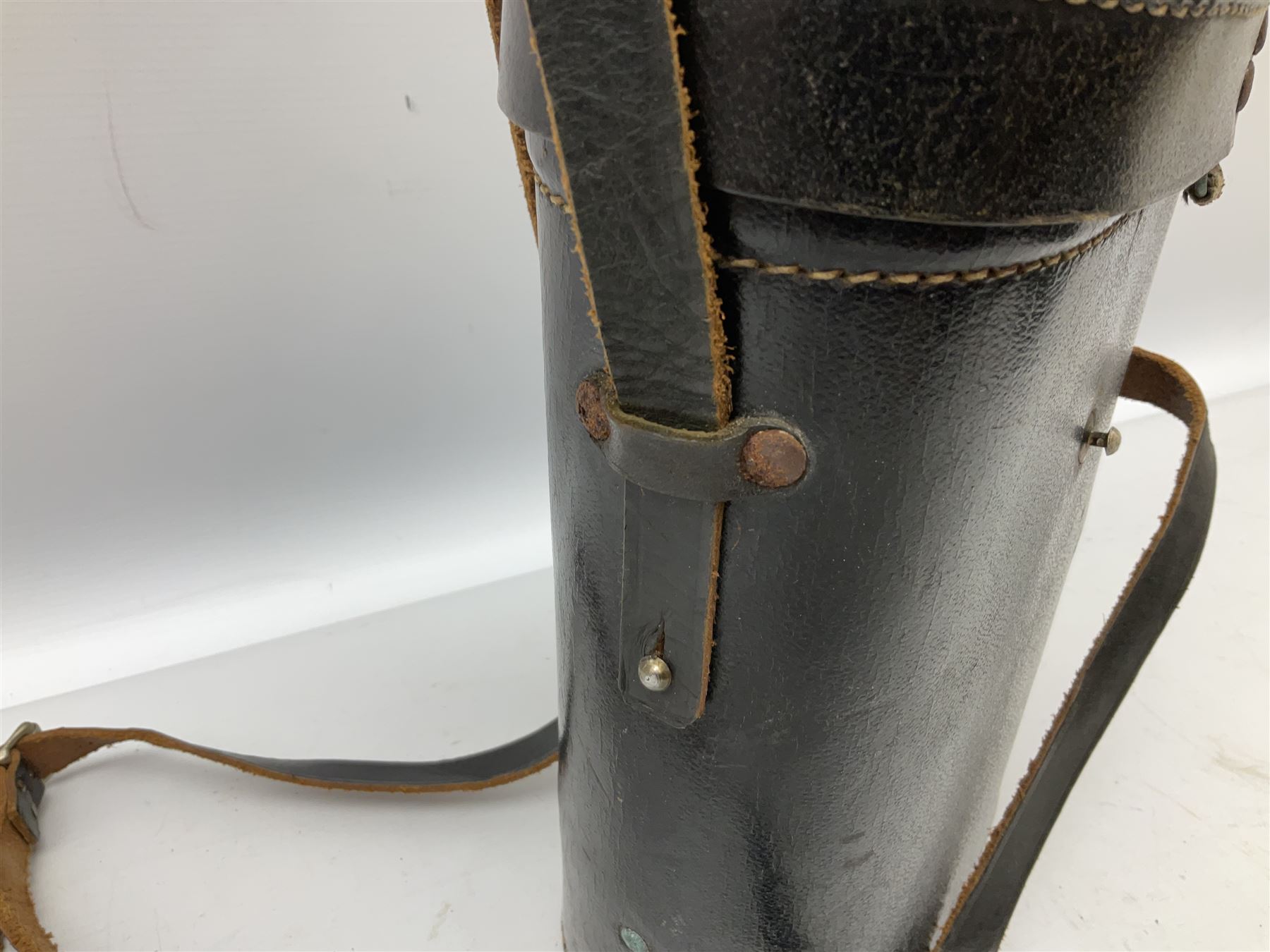 Pair of WWII German U-boat binoculars probably 7 x 50 by Leitz, with rubber eye piece protector covers and leather case stamped with Kriegsmarine mark to the lid and dated 1944, with leather strap.